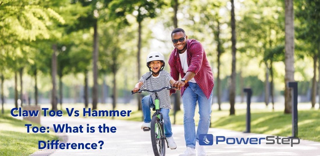 Man helping child ride a bike