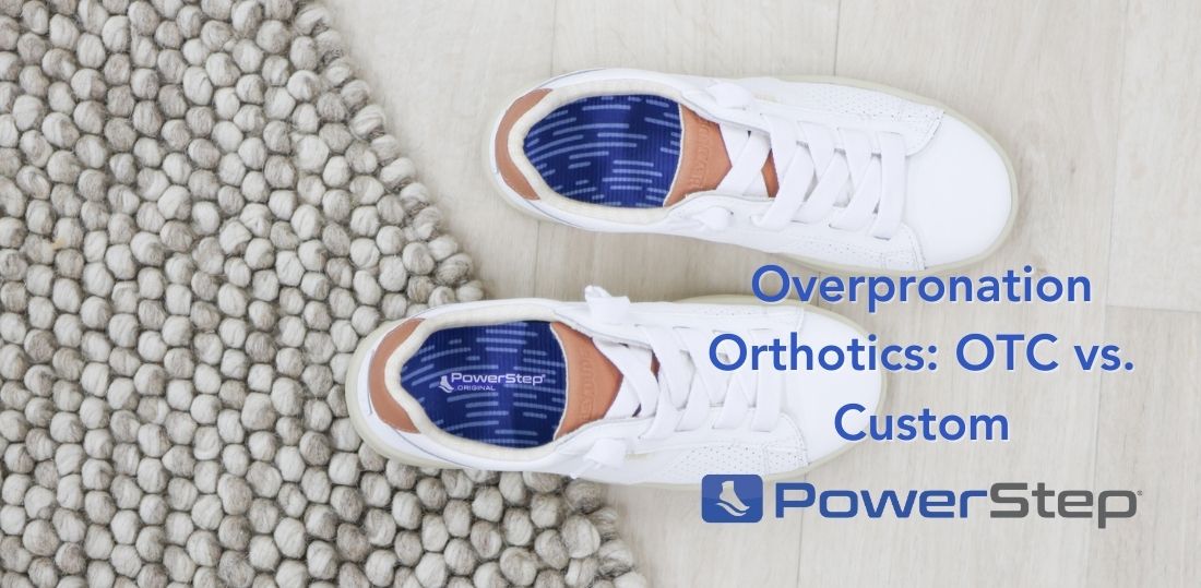 Above shot of white tennis shoes with blue PowerStep insoles