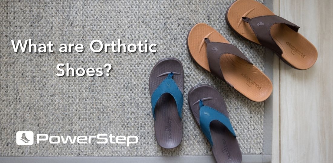Two pairs of orthotic sandals on the rug