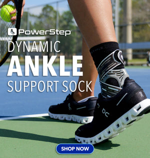 PowerStep Dynamic Ankle Support Sock: Shop Now. Woman playing tennis while wearing DASS.